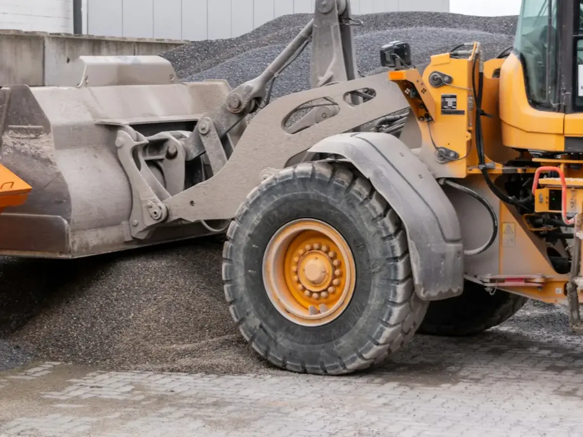 Wheel loader preparing a gravel staging area for crew access